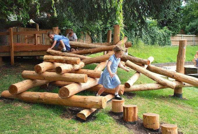 Two children playing on beams